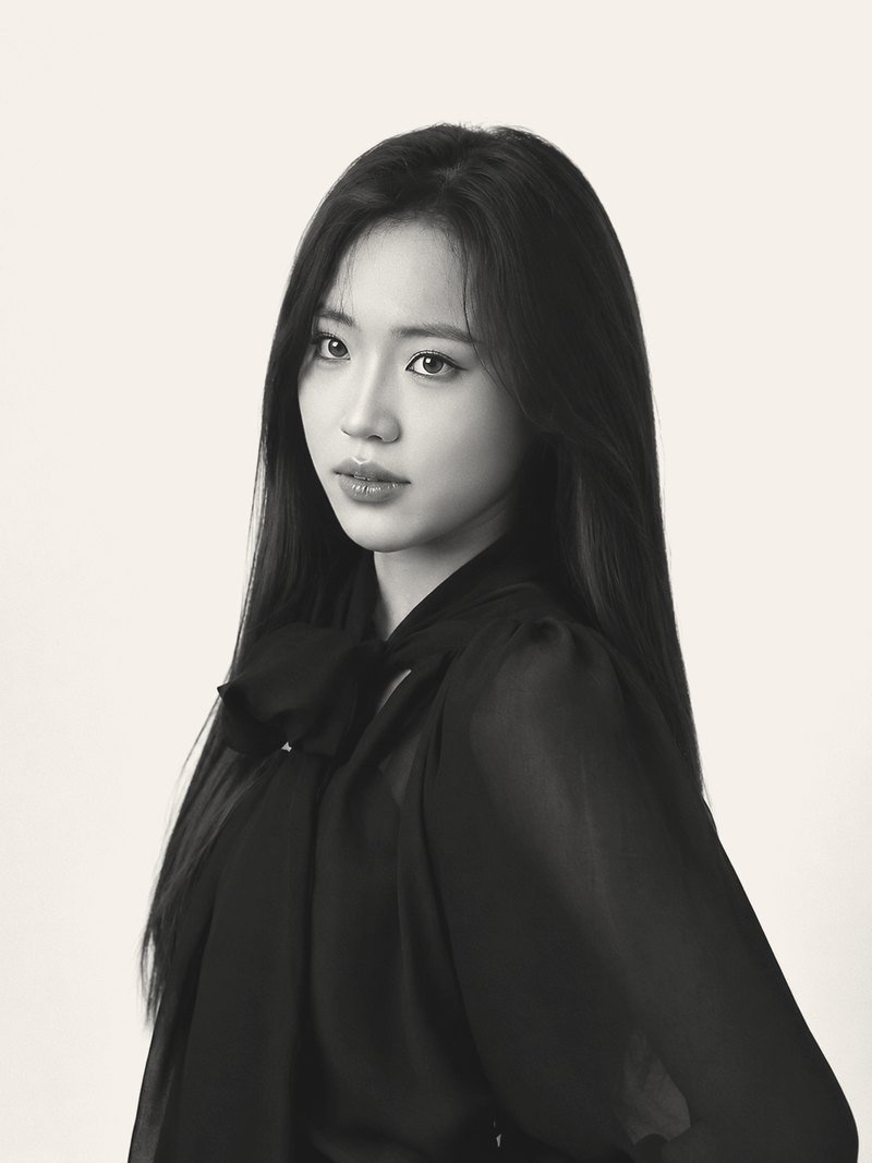 Ta Phuong Linh in a black silk blouse, studio portrait in profile