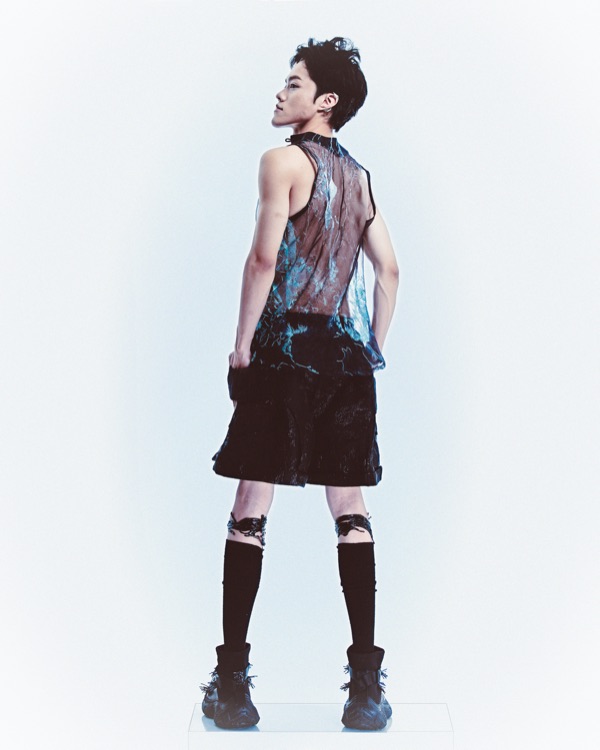 Look C from the back, turquoise embroidery visible through the sheer panel.