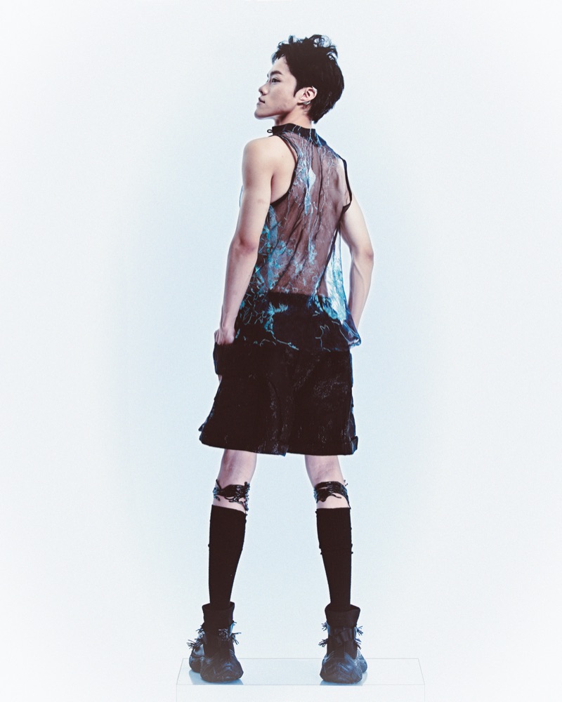 Look C from the back, turquoise embroidery visible through the sheer panel.
